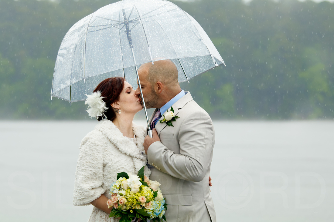 Couples rainy day wedding photography Lake Johnson NC