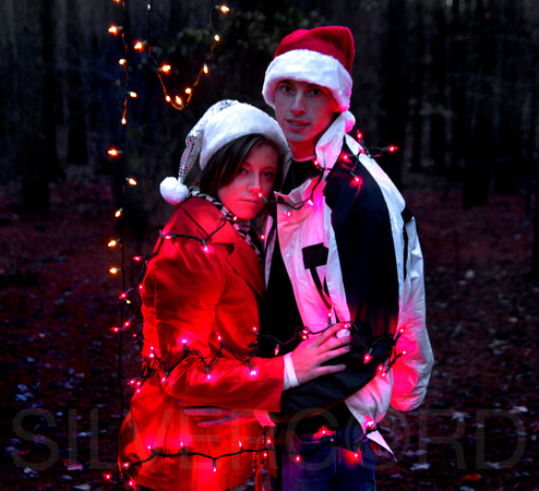 Engagement photography + wrapped in christmas lights + Christmas theme